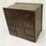 A mahogany twelve-drawer watchmakers or spice tabletop cabinet with brass knobs, approx. 35cm wide