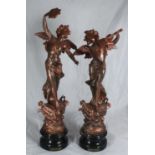 A pair of 19th century spelter figures emblematic of music & dance, on socle bases, later painted,