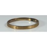 A 10ct gold reeded, stiff bangle, gross weight approximately 16.0g