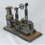 An early 20th century Ernst Plank static table-top steam engine with twin-pistol flywheel crank,