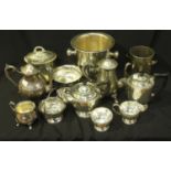 A four-piece silver-plated tea set together with a wine bucket, bottle stand and other plate and