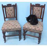 A pair of Edwardian upholstered oak standard chairs, together with an Edwardian walnut octagonal