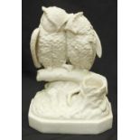 A humorous Parian porcelain owl match holder by Robinson & Leadbeater, modelled as two courting