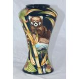 A Moorcroft pottery vase in the Red Panda pattern designed by Sian Leeper, stamped to base, of