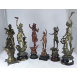 A pair of patinated spelter figures emblematic of 'Commerce' and 'Industry,' together with four