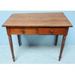 An oak side table with two short frieze drawers, raised on turned supports. 97cm wide