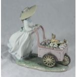 A boxed Lladro porcelain figure, 'Kitty Cart' '6141' with paperwork, 22cm tall