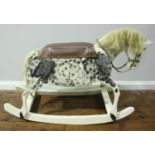 A white painted, wooden rocking horse with grey speckled detail, blonde mane and tail, 120cm long