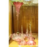 A Victorian Cranberry glass epergne with five flutes. (small piece missing from base)