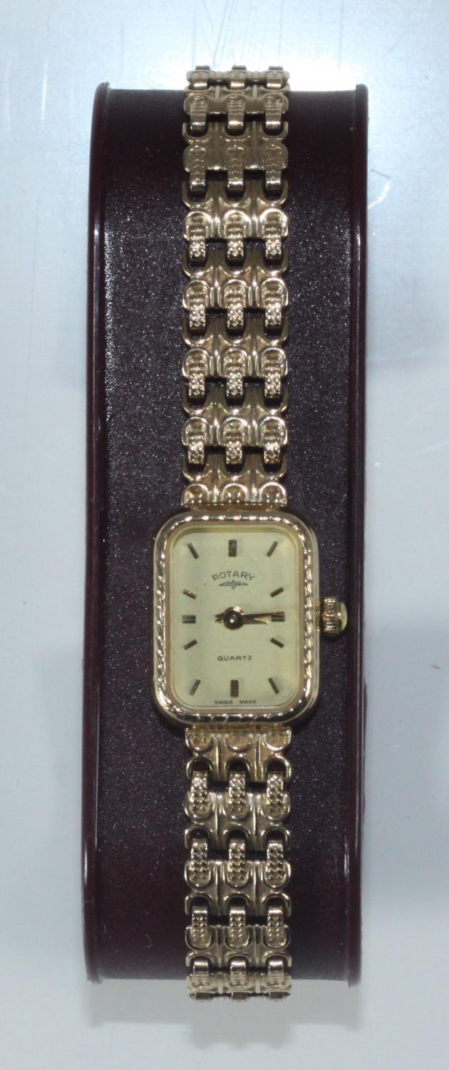 A ladies 9ct gold Rotary cocktail watch, the rectangular champagne dial with batons denoting