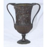 A fine antique continental bronze urn, cast in relief with putto, a goat and fruiting grapevine,