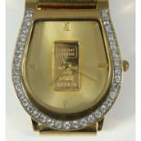 A gents horseshoe shape wristwatch with CZ set bezel and fine gold ingot to the centre of the dial.