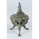 A bronze-cast small urn and cover in the classical style, cast with a figure of Pan finial, masks,