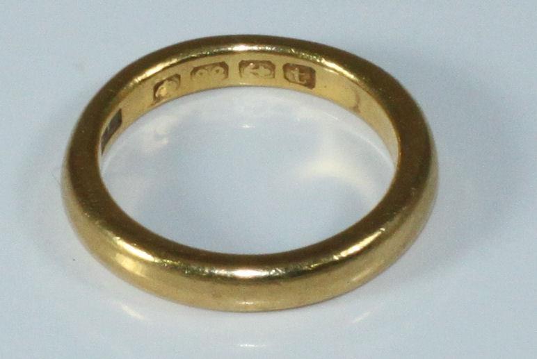 A 22ct gold plain wedding band, 7.29grams, size-M - Image 2 of 2