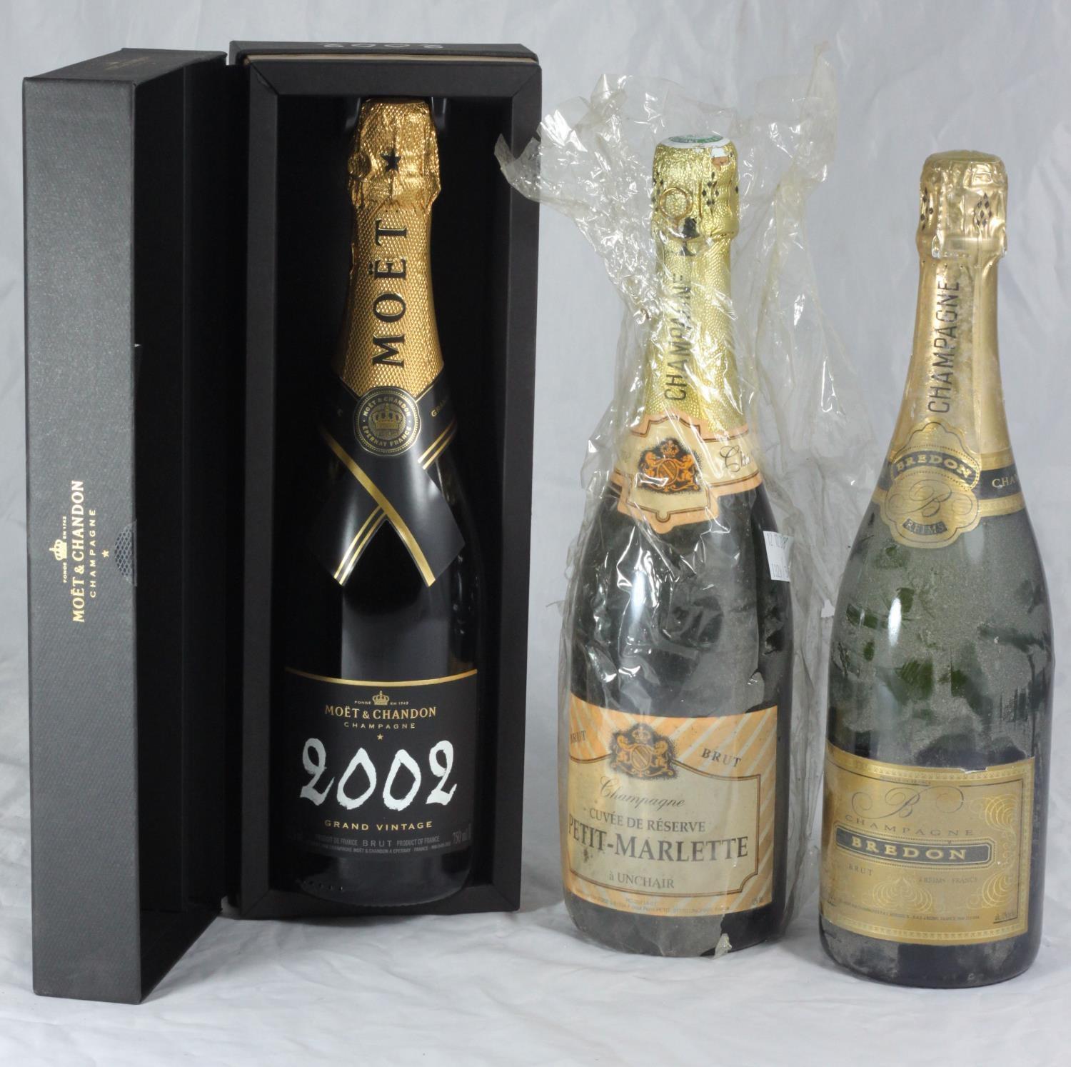 Three bottle of Champagne comprising 1x bottle of Moet & Chandon 2002 Grand Vintage, boxed, together