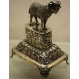 A mid nineteenth century Portuguese silver toothpick stand, the cast ram standing on a floral chased