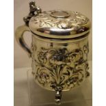 A Danish Norwegian silver pegged tankard, with decoration of repousse scrolling foliage, the