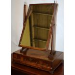 A George II mahogany swing toilet mirror, the moulded frame on side supports, with splay feet