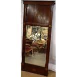 A Channel Islands mahogany veneered pier mirror, the cornice with inlay above a figured panel with