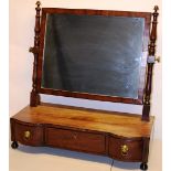 A Regency mahogany swing toilet mirror, the rectangular glass on turned supports, to an inverted