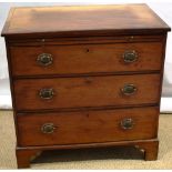 A small early nineteenth century mahogany veneered dressing chest, the cross banded top above a