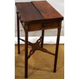 A George III mahogany patience table, the twin flap top above a frieze with a drawer and dummy