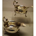 A pair of eighteenth century Irish provincial silver sauceboats, the oval bodies with a fret outline