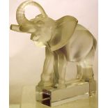 R Lalique France. An opaque 1930's glass model of an elephant, its open mouth with a chip, inscribed