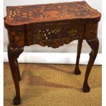 A Dutch marquetry inlaid walnut card table, the foldover top with an urn of flowers, rose velvet