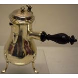 A French provincial late eighteenth century silver coffee pot, the pear shape body with a hinged