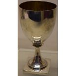 A George III silver wine goblet, the ovoid bowl with a gilded interior, the stem foot on a square