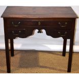 A late eighteenth century fruitwood lowboy, fitted a long drawer and two small drawers, fitted brass