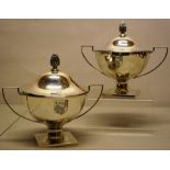 A fine pair of George III silver circular sauce tureens, engraved a coat of arms, having a reeded