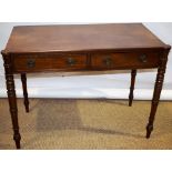 An early nineteenth century mahogany dressing table, the top with front protruding rounded