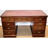 A Victorian mahogany veneered pedestal desk, the top inset maroon leather, above three frieze