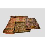 Four Moroccan brocaded flatweave cushion covers, circa 1940s-50s, one 33in. X 12in. 84cm. X 30cm.