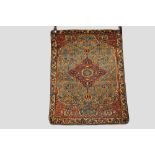 Malayer rug, north west Persia, early 20th century, 3ft. 5in. X 2ft. 7in. 1.04m. X 0.79m. Central