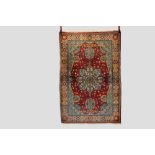 Tabriz rug, north west Persia, mid-20th century, 6ft. 5in. X 4ft. 4in. 1.96m. X 1.32m. Light red