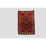 Two rugs: the first a Fars rug, Shiraz area, south Persia, mid-20th century, 4ft. 11in. X 3ft.