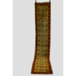 Narrow Anatolian runner, second half 20th century, 12ft. 3in. X 2ft. 5in. 3.73m. X 0.74m. Camel
