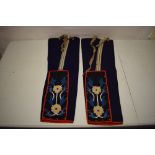 Pair of beadwork panels, 13 3/4in. X 5in. 35cm. X 12.5cm. Dark blue felted wool ground embroidered