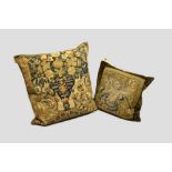 Two tapestry cushions, the first made up of Flemish tapestry, 16th century, 18in. 46cm. Square