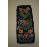 Single beadwork panel, probably second half 19th century, 13in. X 5in. 33cm. X 12.5in. The black