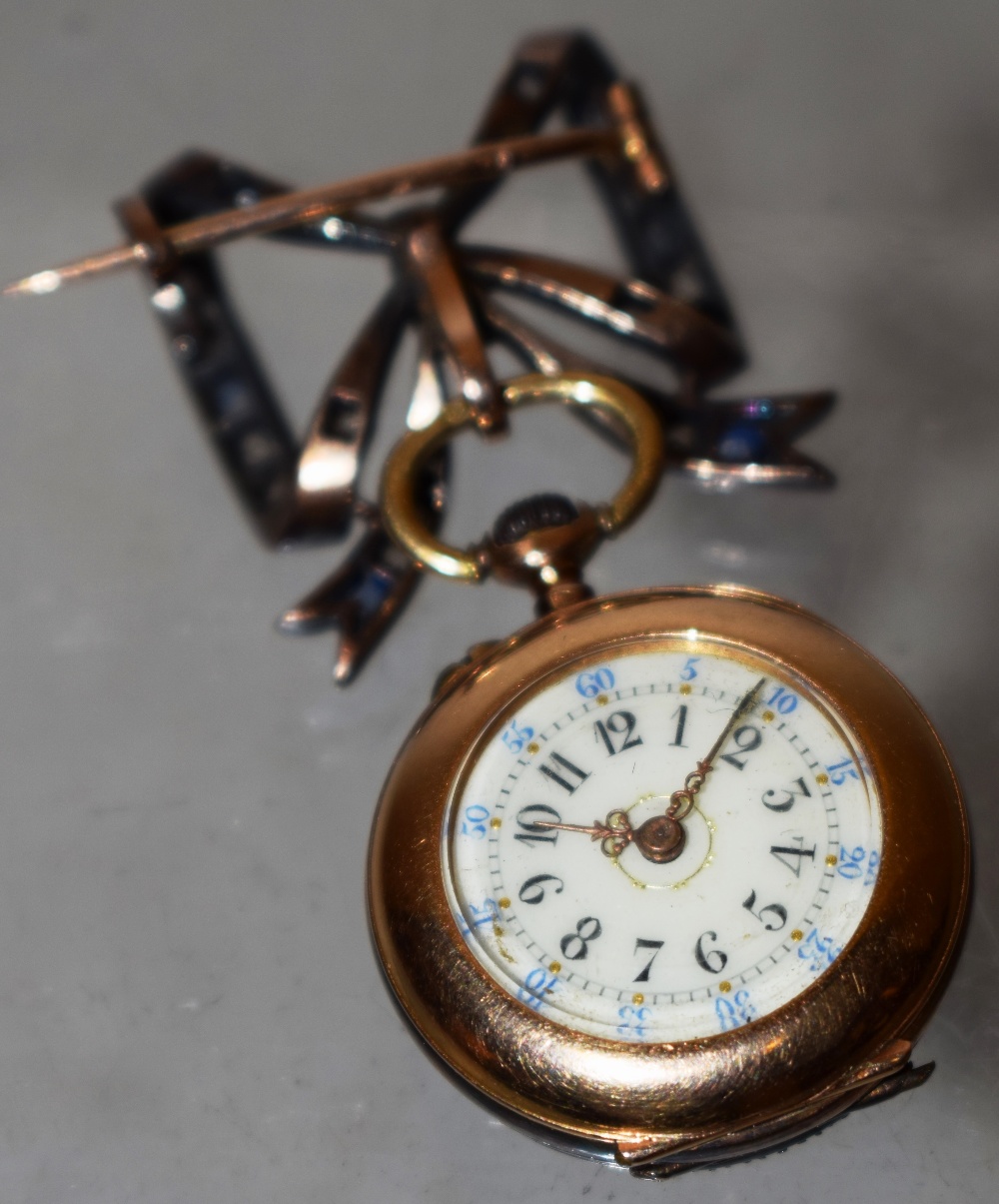 A French late nineteenth century lady's gold fob watch, with a brooch pendant fixing, a cream enamel