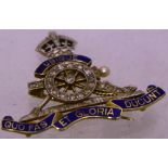 A Royal artillery officers lady's brooch, diamond chips with blue enamel in gold setting.