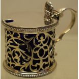 A Victorian silver drum shape mustard pot, the pierced fretwork side with bead edges, the hinged lid