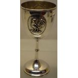 A Victorian silver wine goblet, with oval beaded cartouches, (one with a repousse cast applied