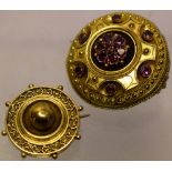 Two Victorian gold target brooches, the larger set with amethyst, 1.5in (4cm) diameter, the