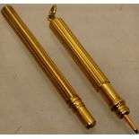 A late Victorian gold propelling pencil and a pencil lead case (2)