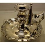 A Victorian silver chamber candlestick, engraved a crest of a beaver, the waisted candleholder